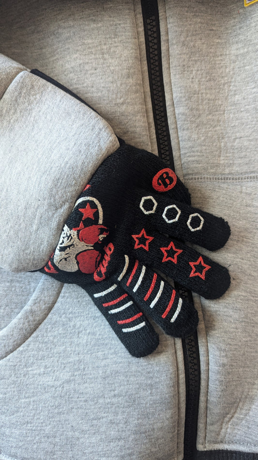 Kids’ jacket with attached black gloves featuring red stars, stripes, and a cartoon character design